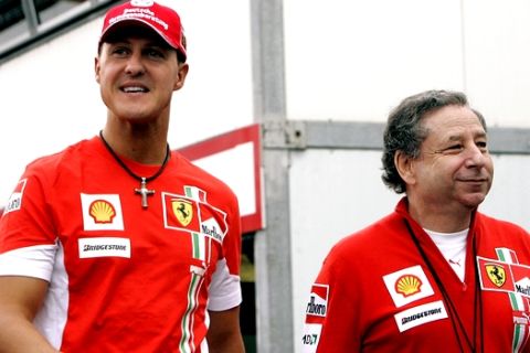 Seven time world champion Michael Schumacher of Germany, left, arrives in the pits along with Ferrari team boss Jean Todt  prior to the third free practice session ahead of Sunday's Formula One Monaco Grand Prix, Saturday, May 26, 2007 at the Monaco race track. (AP Photo/Frank Augstein)