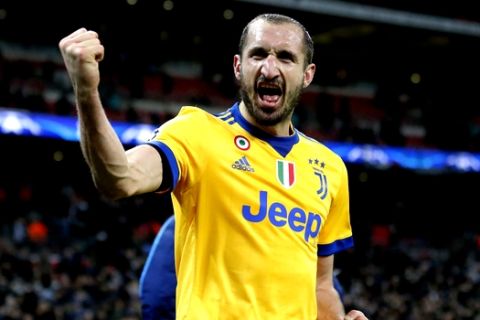 Juventus' Giorgio Chiellini celebrates at the end of a the Champions League, round of 16, second-leg soccer match between Juventus and Tottenham Hotspur, at the Wembley Stadium in London, Wednesday, March 7, 2018. Juventus won 2-1. (AP Photo/Frank Augstein)