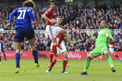 Manchester United's Marouane Fellaini, left, scores his side's first goal of the game during their English Premier League soccer match against Middlesbrough at the Riverside Stadium, Middlesbrough, England, Sunday, March 19, 2017. (Nigel French/PA via AP)