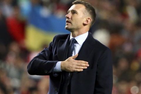Ukraine coach Andriy Shevchenko waves Ukraine's supporters at the end of the Euro 2020 group B qualifying soccer match between Portugal and Ukraine at the Luz stadium in Lisbon, Friday, March 22, 2019. (AP Photo/Armando Franca)