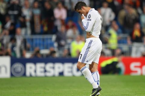 MADRID, SPAIN - APRIL 27:  Cristiano Ronaldo of Real Madrid looks dejected as he leaves the field after defeat to Barcelona in the UEFA Champions League Semi Final first leg match between Real Madrid and Barcelona at Estadio Santiago Bernabeu on April 27, 2011 in Madrid, Spain.  (Photo by Alex Livesey/Getty Images)