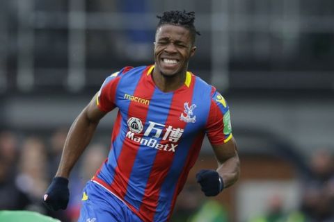Crystal Palace's Wilfried Zaha reacts after missing a chance to score during their English Premier League soccer match between Crystal Palace and Liverpool at Selhurst Park stadium in London, Saturday, March, 31, 2018. (AP Photo/Alastair Grant)