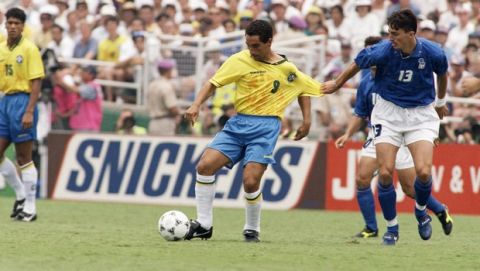 Brazil's Zinho (9) is pulled by Italy's Dino Baggio (13) during first-half, World Cup action, Sunday, July 14, 1994, at the Rose Bowl in Pasadena, Calif. Both teams are vying for a record fourth world title. (AP Photo/Thomas Kienzle)