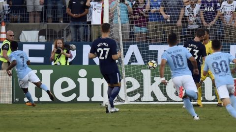 Manchester City forward Raheem Sterling (7) scores a goal against Tottenham Hotspur during the second half of an International Champions Cup match Saturday, July 29, 2017, in Nashville, Tenn. (AP Photo/Mark Zaleski)