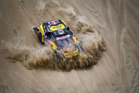Sebastien Loeb and Daniel Elena in the Peugeot 3008 of the PH-Sport going down a dune during stage 1 of the Dakar Rally, between Lima and Pisco, Peru, on January 7, 2019.