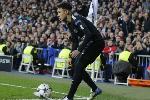 PSG's Neymar prepares to take a corner kick during a Round of 16, 1st leg Champions League soccer match between Real Madrid and Paris Saint Germain at the Santiago Bernabeu stadium in Madrid, Spain, Wednesday Feb. 14, 2018.(AP Photo/Paul White)