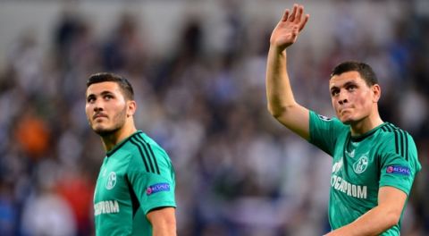 MADRID, SPAIN - MARCH 18:  (L-R) Sead Kolasinac and Kyriakos Papadopoulos of Schalke walk off the pitch following their team's 3-1 defeat during the UEFA Champions League Round of 16, second leg match between Real Madrid and FC Schalke 04 at Estadio Santiago Bernabeu on March 18, 2014 in Madrid, Spain.  (Photo by Stuart Franklin/Bongarts/Getty Images)