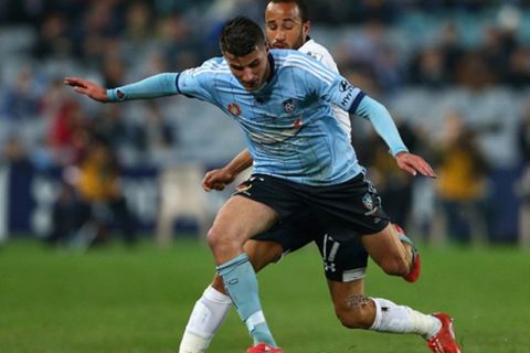 SYDNEY, AUSTRALIA - MAY 30:  Terry Antonis of Sydney FC is tackled by Andros Townsend of Hotspur during the international friendly match between Sydney FC and Tottenham Spurs at ANZ Stadium on May 30, 2015 in Sydney, Australia.  (Photo by Cameron Spencer/Getty Images)