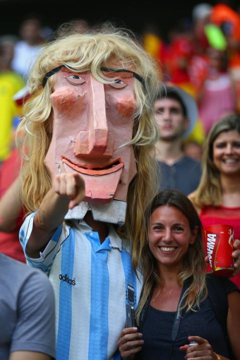 SALVADOR, BRAZIL - JUNE 13: An Argentina fan wears a mask in the crowd before the 2014 FIFA World Cup Brazil Group B match between Spain and Netherlands at Arena Fonte Nova on June 13, 2014 in Salvador, Brazil.  (Photo by Ian Walton/Getty Images)