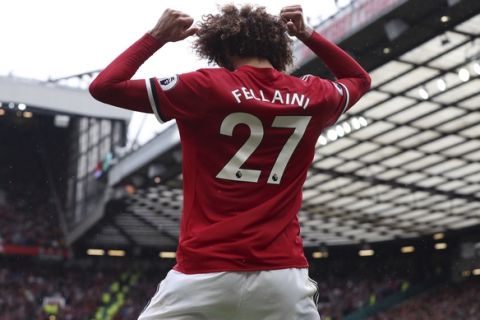 Manchester United's Marouane Fellaini celebrates scoring his side's second goal of the game during the English Premier League soccer match between Manchester United and Crystal Palace at Old Trafford, Manchester, England. Saturday, Sept. 30, 2017. (Martin Rickett/PA via AP)