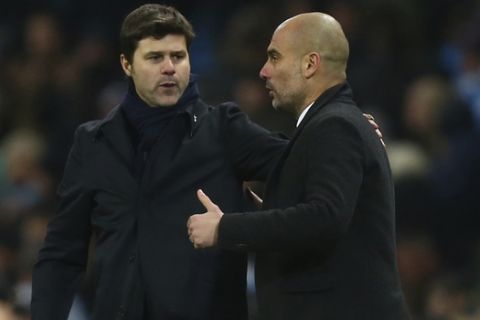 Manchester City's manager Pep Guardiola, right shakes hands with Tottenham Hotspur's manager Mauricio Pochettino after the end of the English Premier League soccer match between Manchester City and Tottenham Hotspur at the Etihad stadium in Manchester, England, Saturday, Jan. 21, 2017. The match ended in a 2-2 draw.(AP Photo/Dave Thompson)