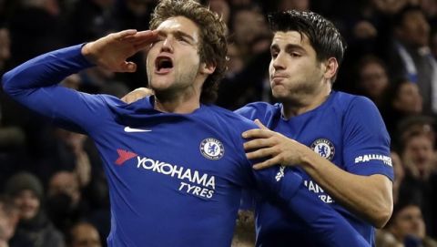 Chelsea's Marcos Alonso, left, celebrates after scoring a goal with teammate Alvaro Morata during the English Premier League soccer match between Chelsea and Brighton & Hove Albion at Stamford Bridge in London, Tuesday Dec. 26, 2017. (AP Photo/Tim Ireland)