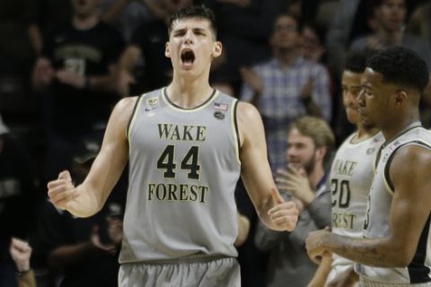Wake Forest's Konstantinos Mitoglou (44) reacts in the second half of an NCAA college basketball gameagainst Louisville in Winston-Salem, N.C., Wednesday, March 1, 2017. Wake Forest won 88-81. (AP Photo/Chuck Burton)