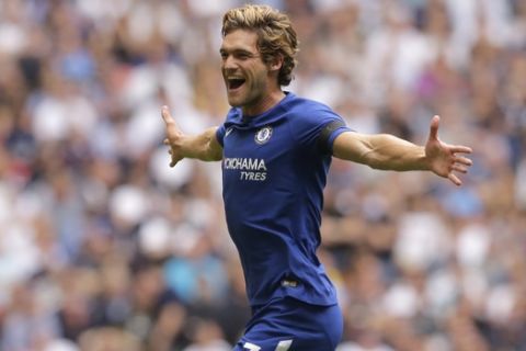 Chelsea's Marcos Alonso celebrates after scoring the opening goal of the game during their English Premier League soccer match between Tottenham Hotspur and Chelsea at Wembley stadium in London, Sunday Aug. 20, 2017. (AP Photo/Alastair Grant)