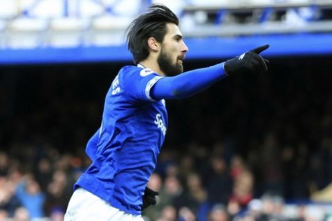Everton's Andre Gomes celebrates scoring his side's first goal of the game, during the  English Premier League soccer match between Everton and Wolverhampton Wanderers at Goodison Park, in Liverpool, England, Saturday, Feb. 2, 2019. (Peter Byrne/PA via AP)