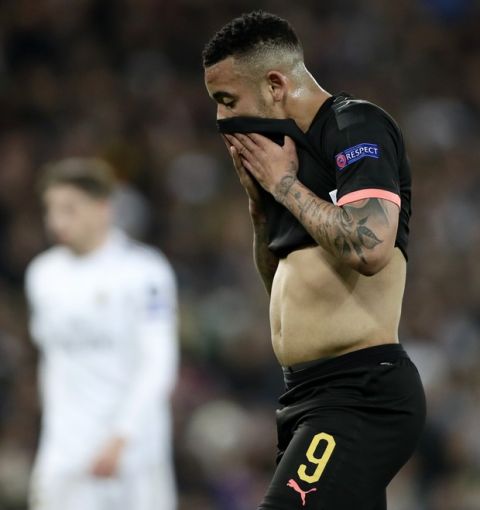 Manchester City's Gabriel Jesus wipes his face during the Champions League, round of 16, first leg soccer match between Real Madrid and Manchester City at the Santiago Bernabeu stadium in Madrid, Spain, Wednesday, Feb. 26, 2020. (AP Photo/Manu Fernandez)
