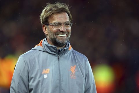 Liverpool coach Jurgen Klopp smiles before the start of the Champions League semifinal, first leg, soccer match between Liverpool and AS Roma at Anfield Stadium, Liverpool, England, Tuesday, April 24, 2018. (AP Photo/Dave Thompson)