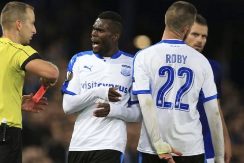 Apollon Limassol's Valentin Roberge, right, is shown a red card during the game against Everton, during the Europa League, Group E soccer match at Goodison Park, Liverpool, England, Thursday Sept. 28, 2017. (Peter Byrne/PA via AP)