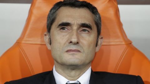 Barcelona's head coach Ernesto Valverde sits on the bench prior the Spanish Super Cup semifinal soccer match between Barcelona and Atletico Madrid at King Abdullah stadium in Jiddah, Saudi Arabia, Thursday, Jan. 9, 2020. (AP Photo/Hassan Ammar)