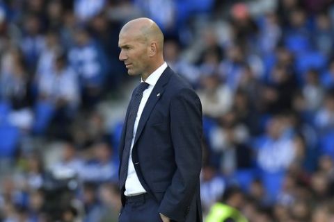 Real Madrid's head manager Zinedine Zidane stands on the touchline during the Spanish La Liga soccer match between Real Sociedad and Real Madrid, at Anoeta stadium, in San Sebastian, northern Spain, Sunday, May 12, 2019. (AP Photo/Alvaro Barrientos)