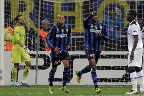 Inter Milan's Cameroonian forward Samuel Eto'o (R) celebrates with teammate French forward Ludovic Biabiany Jonathan Ludovic after scoring a penalty against Tottenham during their Champions League Group A match on October 20, 2010 at San Siro Stadium in Milan. AFP PHOTO / OLIVIER MORIN (Photo credit should read OLIVIER MORIN/AFP/Getty Images)