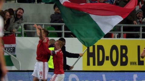 Hungary's forward Tamas Priskin (L) celebrates his score with his teammate midfielder Laszlo Kleinheisler (R) against Norway during the Euro 2016 play-off football match between Norway and Hungary at the Grupama Arena in Budapest on November 15, 2015.   AFP PHOTO / ATTILA KISBENEDEK        (Photo credit should read ATTILA KISBENEDEK/AFP/Getty Images)