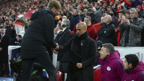 Liverpool coach Juergen Klopp, left, shakes hands with Manchester City coach Josep Guardiola ahead of the Champions League quarter final first leg soccer match between Liverpool and Manchester City at Anfield stadium in Liverpool, England, Wednesday, April 4, 2018. (AP Photo/Dave Thompson)