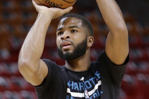 Charlotte Hornets guard Aaron Harrison warms up before the start of an NBA basketball game against the Miami Heat, Friday, Oct. 28, 2016, in Miami. (AP Photo/Wilfredo Lee)