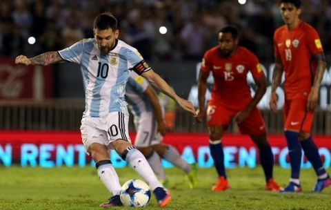 Argentinas Lionel Messi takes a free-kick to score during a 2018 Russia World Cup qualifying soccer match between Argentina and Chile at the Monumental stadium in Buenos Aires, Argentina, Thursday March 23, 2017.((AP Photo/Agustin Marcarian)