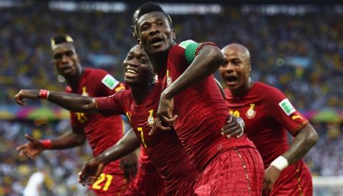 FORTALEZA, BRAZIL - JUNE 21: Asamoah Gyan of Ghana celebrates scoring his team's second goal with teammates during the 2014 FIFA World Cup Brazil Group G match between Germany and Ghana at Castelao on June 21, 2014 in Fortaleza, Brazil.  (Photo by Laurence Griffiths/Getty Images)
