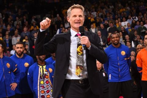 OAKLAND, CA - DECEMBER 15:  Steve Kerr of the Golden State Warriors speaks before the game against the New York Knicks to tribute Craig Sager on December 15, 2016 at ORACLE Arena in Oakland, California. NOTE TO USER: User expressly acknowledges and agrees that, by downloading and or using this photograph, user is consenting to the terms and conditions of Getty Images License Agreement. Mandatory Copyright Notice: Copyright 2016 NBAE (Photo by Noah Graham/NBAE via Getty Images)