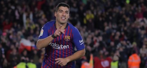 FC Barcelona's Luis Suarez celebrates after scoring during a Spanish Copa del Rey soccer match between FC Barcelona and Sevilla at the Camp Nou stadium in Barcelona, Spain, Wednesday, Jan. 30, 2019. (AP Photo/Manu Fernandez)