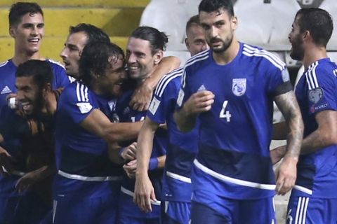 Cyprus' Vincent Laban, center, celebrates his goal with his teammates against Bosnia during their World Cup Group H qualifying soccer match between Cyprus and Bosnia-Herzegovina, at GSP stadium, in Nicosia, Cyprus, Thursday, Aug. 31, 2017. (AP Photo/Petros Karadjias)