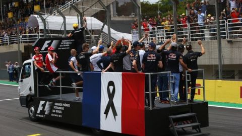 SAO PAULO, BRAZIL - NOVEMBER 15:  Lewis Hamilton of Great Britain and Mercedes GP and the other drivers are seen during drivers' parade with the french flag to honor the victims of the terrorist attacks in Paris prior to the Formula One Grand Prix of Brazil at Autodromo Jose Carlos Pace on November 15, 2015 in Sao Paulo, Brazil.  (Photo by Mark Thompson/Getty Images)