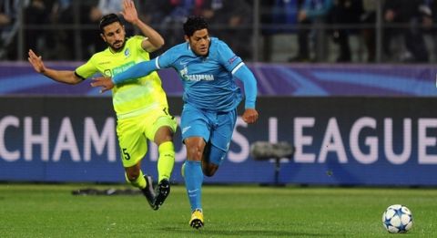 Ghent's Israeli midfielder Kenny Saief (L) vies with Zenit's Brazilian forward Hulk during the UEFA Champions League group H football match between FC Zenit and KAA Gent at the Petrovsky stadium in St. Petersburg on September 29, 2015. AFP PHOTO / OLGA MALTSEVA        (Photo credit should read OLGA MALTSEVA/AFP/Getty Images)