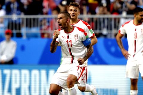 Serbia's Aleksandar Kolarov celebrates after scoring the opening goal during the group E match between Costa Rica and Serbia at the 2018 soccer World Cup in the Samara Arena in Samara, Russia, Sunday, June 17, 2018. (AP Photo/Mark Baker)