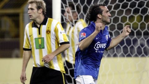 Bochum's scorer Theofanis Gekas from Greece, right, celebrates during a German first division soccer match between Borussia Dortmund and VfL Bochum at the Signal Iduna Park stadium in Dortmund, Germany, Friday, Oct. 20, 2006. At left is Dortmund's Markus Brzenska. (AP Photo/Michael Sohn) ** NO MOBILE USE UNTIL 2 HOURS AFTER THE MATCH, WEBSITE USERS ARE OBLIGED TO COMPLY WITH DFL-RESTRICTIONS, SEE INSTRUCTIONS FOR DETAILS **