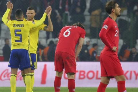 Sweden's Martin Olsson and Sweden's Marcus Berg, left, celebrate their victory after the UEFA Nations League soccer match between Turkey and Sweden in Konya, Turkey, Saturday, Nov. 17, 2018. (AP Photo)