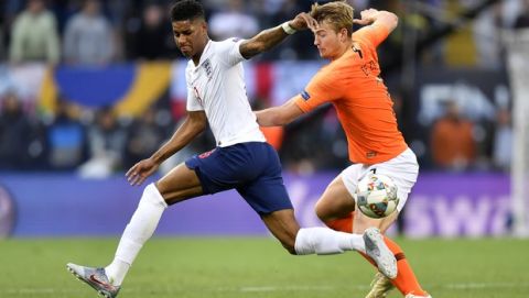 England's Marcus Rashford, left, fights for the ball with Netherlands' Matthijs de Ligt during the UEFA Nations League semifinal soccer match between Netherlands and England at the D. Afonso Henriques stadium in Guimaraes, Portugal, Thursday, June 6, 2019. (AP Photo/Martin Meissner)