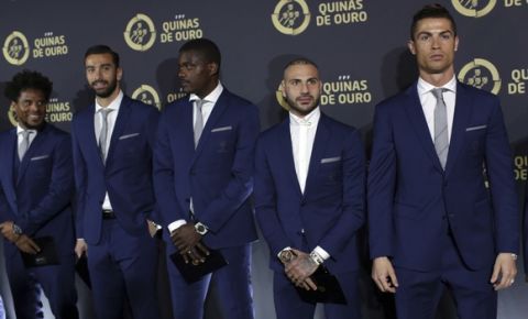 Cristiano Ronaldo, right, poses with his Portugal teammates as they arrive to attend the Portuguese Federation soccer awards ceremony in Estoril, outside Lisbon, Monday, March 20, 2017. Players are, from left to right, Eliseu, Rui Patricio, William Carvalho, Ricardo Quaresma and Ronaldo. (Armando Franca)