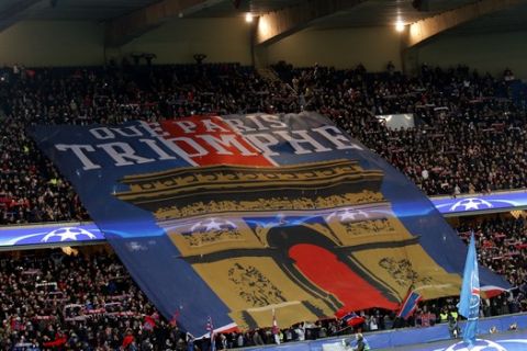 PSG's fans display a giant banner with the Arc de Triomphe before the Champions League round of 16, 1st leg soccer match between Paris Saint Germain and Chelsea at the Parc des Princes stadium in Paris, France, Tuesday, Feb. 16, 2016. The board reads : Here it is Paris. (AP Photo/Christophe Ena)