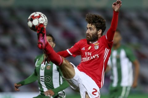 Benfica's Rafa reaches for the ball during the Portuguese League soccer match between Rio Ave FC and Benfica in Vila do Conde, Portugal, Wednesday, June 17, 2020. The Portuguese League soccer matches are being played without spectators because of the coronavirus pandemic. (Jose Coelho/Pool via AP)