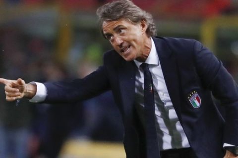 FILE - In this Friday, Sept. 7, 2018 file photo, Italy coach Roberto Mancini gestures during the UEFA Nations League soccer match between Italy and Poland at Dall'Ara stadium in Bologna, Italy. Italy coach Roberto Mancini had his contract extended through 2026 on Monday, May 17, 2021, allowing him to stay in charge of the Azzurri for the next two World Cups. (AP Photo/Antonio Calanni, File)