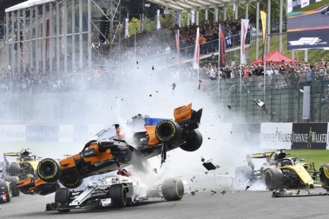 Mclaren driver Fernando Alonso of Spain, center top, crashes at the start of the Belgian Formula One Grand Prix in Spa-Francorchamps, Belgium, Sunday, Aug. 26, 2018. (AP Photo/Geert Vanden Wijngaert)