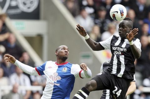 Newcastle United's Cheik Tiote, right, vies for the ball with Blackburn Rovers' David Hoilett during their English Premier League soccer match at St James' Park, Newcastle, England, Saturday, Sept. 24, 2011. (AP Photo/Scott Heppell)