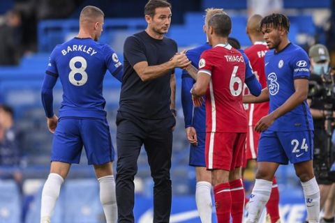 Chelsea's head coach Frank Lampard salutes Liverpool's Thiago after the English Premier League soccer match between Chelsea and Liverpool at Stamford Bridge Stadium, Sunday, Sept. 20, 2020. (Michael Regan/Pool via AP)