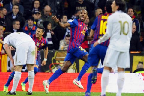 Barcelona's French defender Eric Abidal (C) celebrates after scoring during the Spanish Cup "El clasico" football match Real Madrid vs Barcelona at the Santiago Barnabeu stadium in Madrid on January 18, 2012.   AFP PHOTO/JAVIER SORIANO (Photo credit should read JAVIER SORIANO/AFP/Getty Images)
