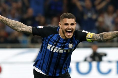 Inter Milan's Mauro Icardi celebrates after Juventus' Andrea Barzagli scoring own goal past his goalkeeper during the Serie A soccer match between Inter Milan and Juventus at the San Siro stadium in Milan, Italy, Saturday, April 28, 2018. (AP Photo/Antonio Calanni)