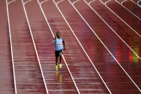 Botswana's Isaac Makwala runs a men's 200-meter individual time trial during the World Athletics Championships in London Wednesday, Aug. 9, 2017. Makwala ran to qualify for the 200m semi-finals after he missed the 200m heats and the 400m final as he was barred from competing for 48 hours while organizers tried to halt a norovirus outbreak. (AP Photo/Martin Meissner)
