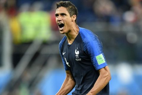 France's Raphael Varane celebrates after his team advanced to the final after the semifinal match between France and Belgium at the 2018 soccer World Cup in the St. Petersburg Stadium in St. Petersburg, Russia, Tuesday, July 10, 2018. (AP Photo/Martin Meissner)
